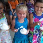 Children eating vanilla ice cream
