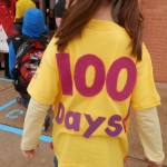 Young child wearing a 100 Days t-shirt